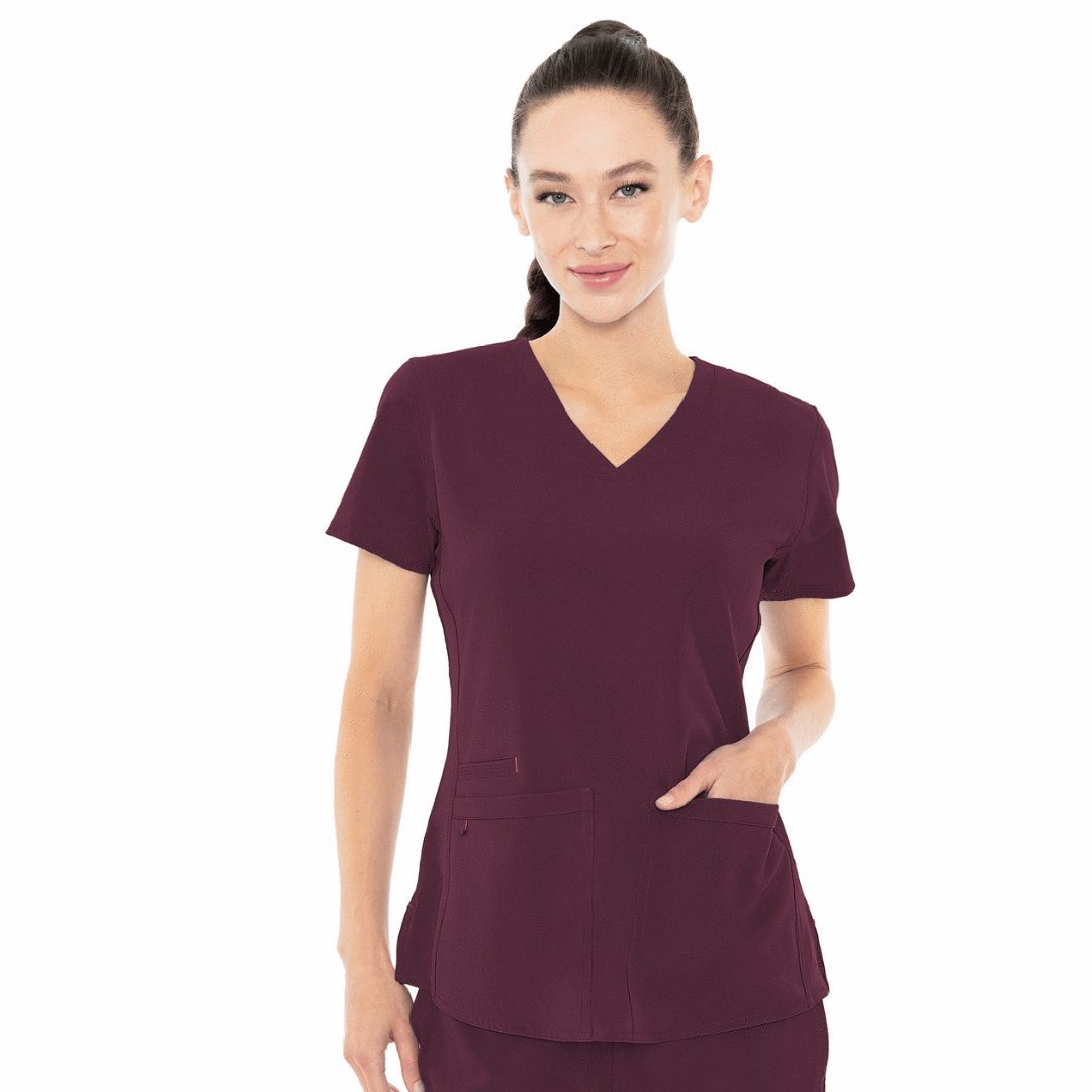 White Background Female Model Wearing Med Couture Energy Scrub Top in Pewter